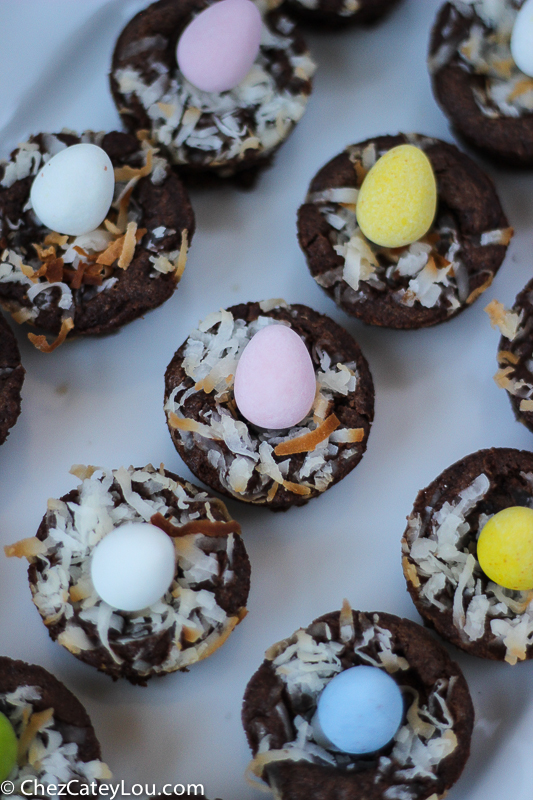Mini Easter Brownie Nests - brownie bites are topped with toasted coconut and a candy egg to look like a bird's nest.  The perfect Easter treat! | ChezCateyLou.com