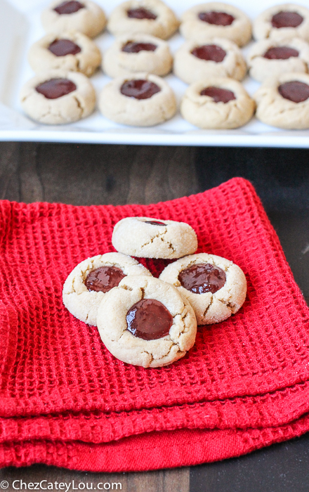 PBJ Thumbprint Cookies - the classic peanut butter and jelly flavor combo in a festive Christmas cookie! |ChezCateyLou.com