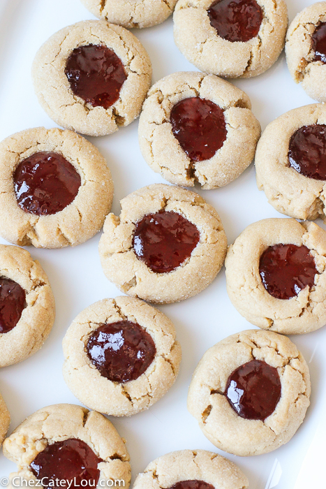 PBJ Thumbprint Cookies - the classic peanut butter and jelly flavor combo in a festive Christmas cookie! |ChezCateyLou.com