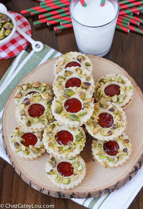 Pistachio Wreath Cookies - festive Linzer cookies decorated to look like a Christmas wreath! | ChezCateyLou.com