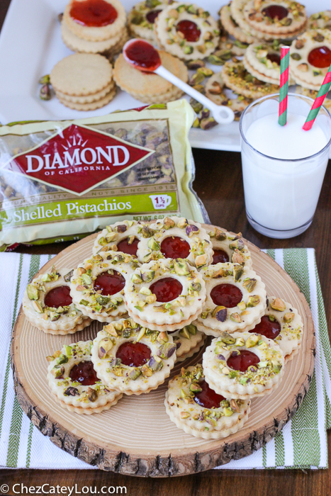 Pistachio Wreath Cookies - festive Linzer cookies decorated to look like a Christmas wreath! | ChezCateyLou.com